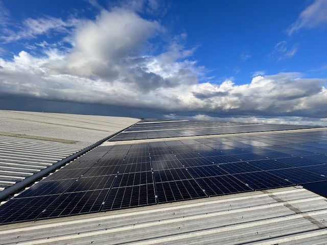 Sun over solar panels